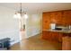 Bright dining area with wood cabinets and chandelier at 626 Barksdale Dr, Forest Park, GA 30297