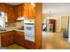 Galley kitchen with wood cabinets and appliances at 626 Barksdale Dr, Forest Park, GA 30297