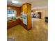 Galley kitchen with wood cabinets and appliances at 626 Barksdale Dr, Forest Park, GA 30297