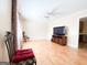 Living room with hardwood floors and TV stand at 626 Barksdale Dr, Forest Park, GA 30297