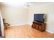 Living room with hardwood floors and TV stand at 626 Barksdale Dr, Forest Park, GA 30297