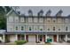 Three-unit townhome building with attached garages and private decks at 1699 Redan West, Lithonia, GA 30058
