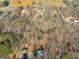 Aerial view showing property lot size and location amongst other homes and wooded area at 1200 Mount Carmel Rd, Mcdonough, GA 30253