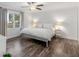 Main bedroom with hardwood floors and large windows at 1200 Mount Carmel Rd, Mcdonough, GA 30253