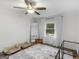 Bedroom featuring hardwood floors, a ceiling fan, and pet beds at 1200 Mount Carmel Rd, Mcdonough, GA 30253