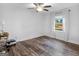 Spacious bedroom with hardwood floors and a view of the backyard at 1200 Mount Carmel Rd, Mcdonough, GA 30253