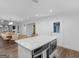Eat-in kitchen with island, stainless steel appliances, and access to dining and outdoor spaces at 1200 Mount Carmel Rd, Mcdonough, GA 30253