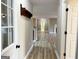 Bright hallway with hardwood floors and coat rack at 7963 Smith Rd, Villa Rica, GA 30180