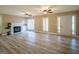 Inviting living area features modern flooring, a fireplace with built-ins, and a bright, welcoming atmosphere at 7963 Smith Rd, Villa Rica, GA 30180