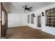 Screened porch with ceiling fan and wood flooring at 35 Knights Dr, Covington, GA 30016