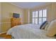 Bedroom with hardwood floors and plantation shutters at 104 Masters N Dr, Peachtree City, GA 30269