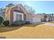 Ranch home with brick facade, attached garage, and landscaping at 104 Masters N Dr, Peachtree City, GA 30269