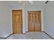 Bedroom with closet, door, neutral carpet and paint, and a ceiling fan at 215 Kingswood Dr, Fayetteville, GA 30215