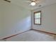 Bedroom with a ceiling fan, a large window, neutral paint, and carpet at 215 Kingswood Dr, Fayetteville, GA 30215