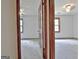 Bedroom with neutral carpet and paint, a ceiling fan, and large windows at 215 Kingswood Dr, Fayetteville, GA 30215