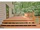 Spacious wood deck with railings, perfect for outdoor relaxation and entertainment at 215 Kingswood Dr, Fayetteville, GA 30215