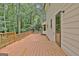 Rear deck offers plenty of space for grilling and entertaining with wooded views at 215 Kingswood Dr, Fayetteville, GA 30215