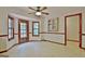 Bright dining area with bay window, cabinet, ceiling fan and view to the deck at 215 Kingswood Dr, Fayetteville, GA 30215