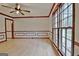 Bright dining room featuring hardwood floors and wainscoting at 215 Kingswood Dr, Fayetteville, GA 30215