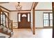 Bright entryway with hardwood floors, staircase, and wood accents at 215 Kingswood Dr, Fayetteville, GA 30215