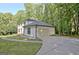 Another view of house from driveway, highlighting garage and landscaping at 215 Kingswood Dr, Fayetteville, GA 30215