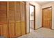 Hallway with closet and doorway leading to bathroom with patterned shower curtain, sink, and vanity at 215 Kingswood Dr, Fayetteville, GA 30215