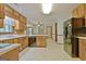 Bright kitchen with classic wood cabinetry, modern appliances, and open layout at 215 Kingswood Dr, Fayetteville, GA 30215