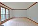Spacious living room with hardwood floors and large windows at 215 Kingswood Dr, Fayetteville, GA 30215