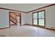 Living area with hardwood floors, staircase and window view at 215 Kingswood Dr, Fayetteville, GA 30215
