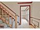 Elegant staircase with carpeted steps and wooden railing at 215 Kingswood Dr, Fayetteville, GA 30215