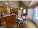 Kitchen with breakfast nook and hardwood floors at 306 Oakwind Way, Canton, GA 30114