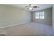 Spacious bedroom with neutral walls and carpeted flooring at 169 Holly Ct, Loganville, GA 30052