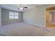 Spacious bedroom with neutral walls, carpeted flooring and ceiling fan at 169 Holly Ct, Loganville, GA 30052
