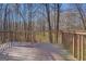 Wooden deck overlooking a wooded backyard at 169 Holly Ct, Loganville, GA 30052