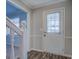 Interior entryway with white door and staircase at 169 Holly Ct, Loganville, GA 30052