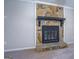 Detailed view of the stone fireplace at 169 Holly Ct, Loganville, GA 30052