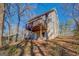 Two-story house with deck and wooded backyard at 169 Holly Ct, Loganville, GA 30052