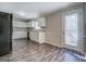 Modern kitchen with white cabinets, granite countertops, and stainless steel appliances at 169 Holly Ct, Loganville, GA 30052