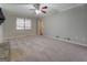 Living room with carpeted floor and fireplace at 169 Holly Ct, Loganville, GA 30052