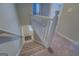 Staircase with white railing leading to the upper level at 169 Holly Ct, Loganville, GA 30052