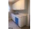 White kitchen cabinets, granite countertops, and dishwasher at 2176 Lilac Ln, Decatur, GA 30032