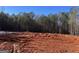Newly prepared homesite ready for construction, surrounded by a lush forest backdrop at 2 Bob Smith Rd, Sharpsburg, GA 30277