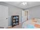 Bedroom with bookcase and ceiling fan at 149 Pristine Dr, Locust Grove, GA 30248