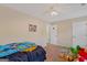 Bright bedroom with double doors and ceiling fan at 149 Pristine Dr, Locust Grove, GA 30248