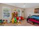 Spacious bedroom with ample natural light and built-in shelving at 149 Pristine Dr, Locust Grove, GA 30248