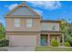 Two-story house with a neutral color scheme and a teal front door at 149 Pristine Dr, Locust Grove, GA 30248