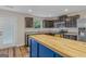 Kitchen with dark cabinets, granite countertops and a butcher block island at 149 Pristine Dr, Locust Grove, GA 30248