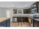 Kitchen with dark cabinets, granite countertops, and a butcher block island at 149 Pristine Dr, Locust Grove, GA 30248