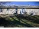 View of the backyard of a home with a grill, patio set, and lush green space at 106 Gwenellen Dr, Locust Grove, GA 30248