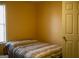 Bedroom with a neutral color scheme and a large window for natural light at 106 Gwenellen Dr, Locust Grove, GA 30248